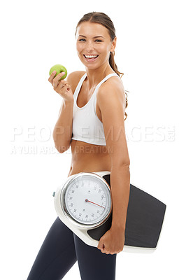 Buy stock photo Portrait, happiness or woman with apple, scale and smile for weight loss, nutrition or body goals. Studio, healthy lifestyle or model happy for fruit benefit, diet food or fitness on white background