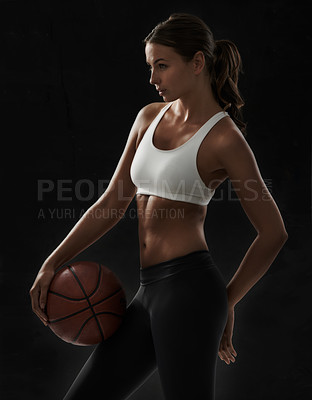 Buy stock photo Cropped view of a young woman in sportswear holding a basketball