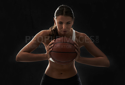 Buy stock photo Serious, woman and portrait with basketball for sports and game in black background or studio. Fitness, challenge and intense athlete on the court, competition or training in workout and exercise