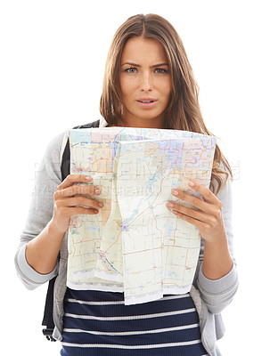 Buy stock photo Map, confused and woman reading in studio for hiking adventure, weekend trip or vacation. Travel, discover and portrait of person with paper directions for tourism and navigation by white background.