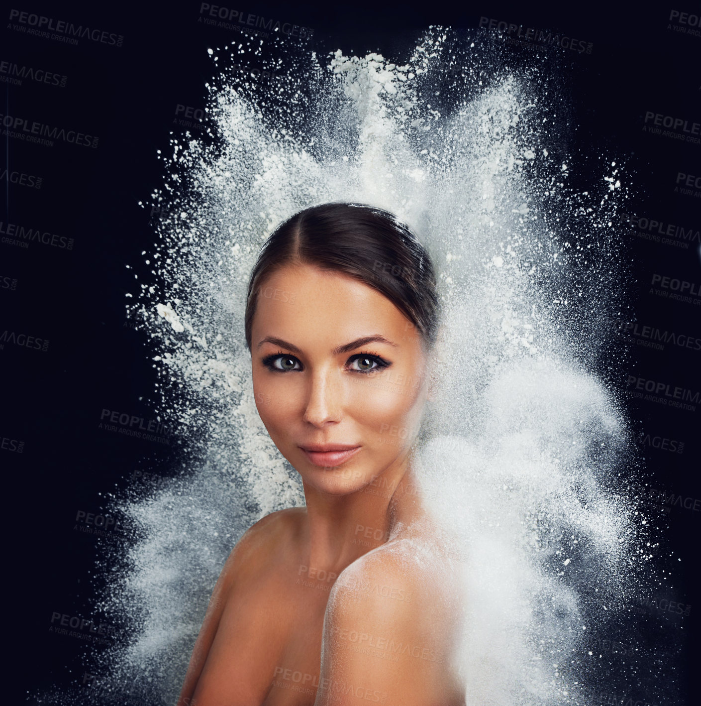 Buy stock photo A young woman with bare shoulders being enveloped by a burst of white powder