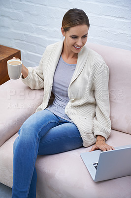 Buy stock photo Cropped shot of an attractive young woman relaxing on the sofa at home