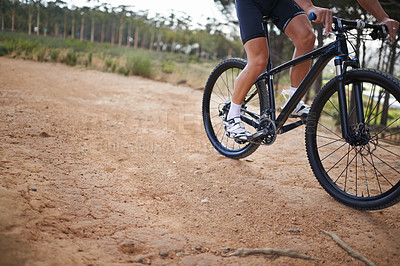 Buy stock photo Person, legs and mountain bike for cycling fitness on nature path for health challenge, performance or extreme sport. Athlete, exercise and off road dirt terrain or adventure, wellness or competition