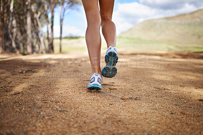 Buy stock photo Legs, sneakers and person running in nature, woods or forest with fitness for health and wellness outdoor. Sports, workout and training, behind runner in race or marathon athlete for exercise in park