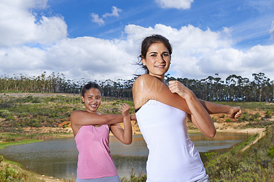 Buy stock photo Young women, stretching and portrait in countryside for exercise in outdoor by trees and lake. Diversity, teenagers or face to workout by blue sky, happy or wellness with sportswear to train in woods