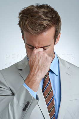 Buy stock photo Businessman, headache and stress in studio for debt, mental health and bankrupt or burnout. Male person, migraine and frustrated by white background, deadline and depression or mistake and tension