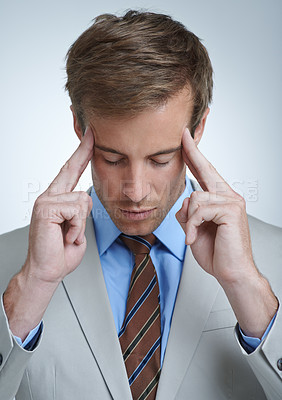 Buy stock photo Businessman, headache and burnout in studio for job, mental health and bankrupt or stress. Male person, migraine and frustrated by white background, deadline and depression or mistake and tension