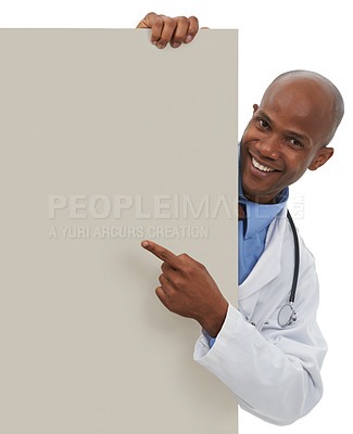 Buy stock photo Happy doctor, portrait and black man point at poster, hospital promo or medicine announcement. Mockup studio space, advertising banner and African surgeon with healthcare sign on white background