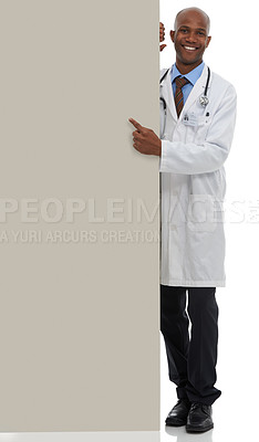 Buy stock photo Placard, black man and portrait of doctor point at poster mockup, hospital services or health information. Studio space, cardboard banner and healthcare worker for medical support on white background