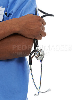 Buy stock photo Cropped view of a medical resident with his arms folded and holding a stethoscope in his one hand