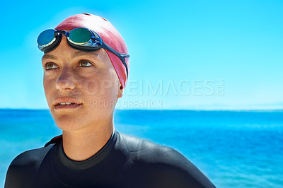 Buy stock photo Swimmer, water and woman at ocean outdoor in summer for exercise, training or workout on mockup space. Sea, sport athlete or person in goggles in nature for fitness, health or triathlon at the beach