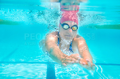 Buy stock photo Sports, underwater or woman in swimming pool for competition training, workout or energy. Fitness, female swimmer and fast athlete diving for cardio exercise, championship and race practice at gala