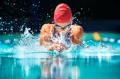 Buy stock photo Shot of a young female swimmer doing the butterfly stroke