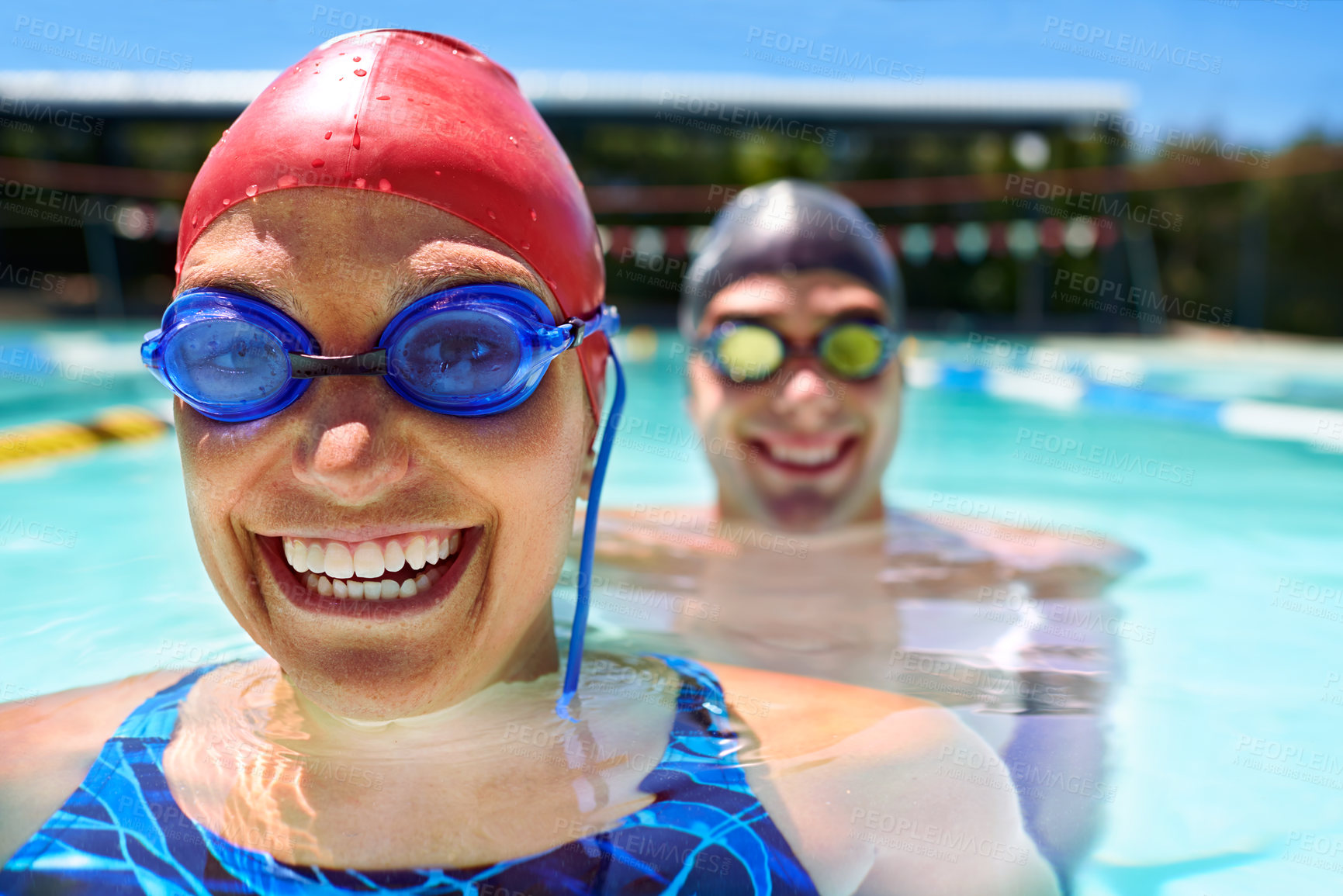 Buy stock photo Goggles, portrait or happy couple in swimming pool for sports training, workout or teamwork for fitness. Face, swimmers or athletes in exercise for support, health or wellness with smile in water