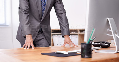 Buy stock photo Businessman, office and standing at desk, computer and corporate wear for business, boss and career. Leadership, management and strategy for company, workplace and manager with suit and formal