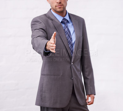 Buy stock photo Business man, handshake and introduction for interview, agreement or welcome to deal, success and thank you. Professional or corporate person shaking hands for partnership on a white wall background