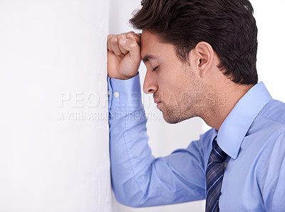 Buy stock photo Stress, business man and head on wall for financial crisis, burnout and anxiety for challenge fail. Depression, frustrated and a tired professional in bankruptcy, debt and mistake in office mockup