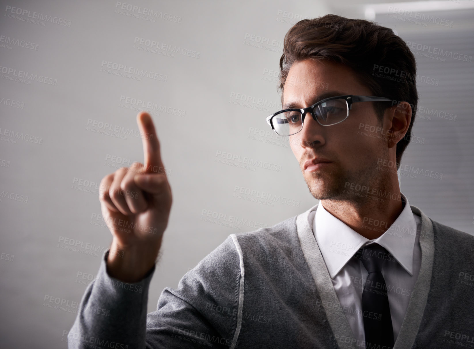 Buy stock photo Businessman, finger and digital interface for futuristic technology with ai, glasses and innovation in office. Young person, vision and serious with thinking in virtual iot, professional and cyber