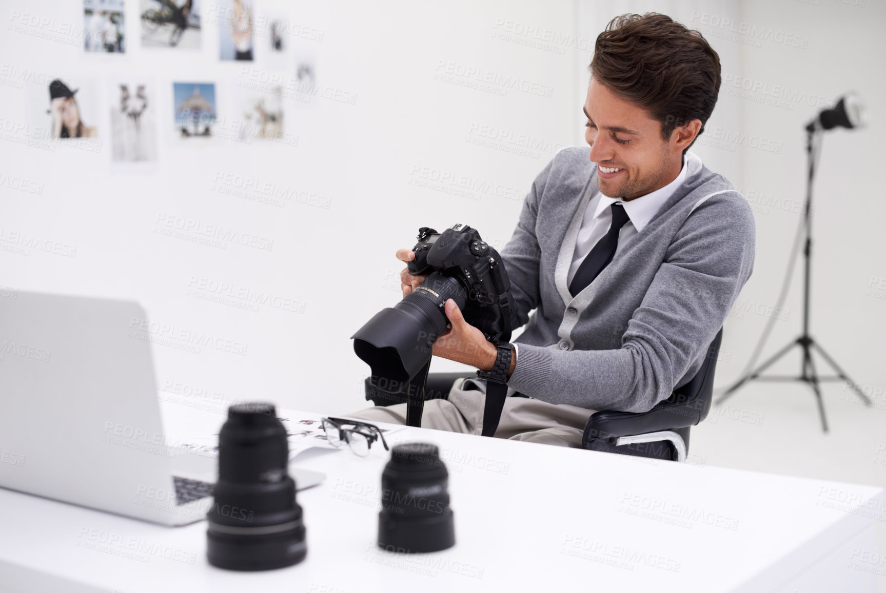 Buy stock photo Man, camera and photography in office with happy smile, checking image batch and creative in workplace. Person, thinking and glasses for vision, technology and editor in agency for digital photoshoot