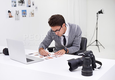 Buy stock photo Writing, photography and man in office editing with production, process and technology. Professional, editor and creative person working on desk with photoshoot results, review or notes for magazine