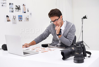 Buy stock photo Photographer, editing and thinking with computer in office with media, process and production. Professional, editor and creative person with choice on laptop with photoshoot results or cinematography