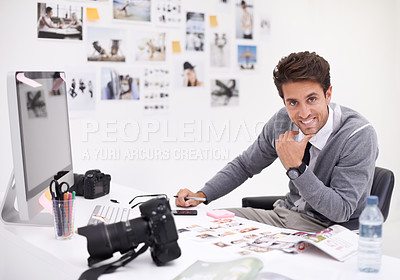 Buy stock photo A photographer looking at his images in his office