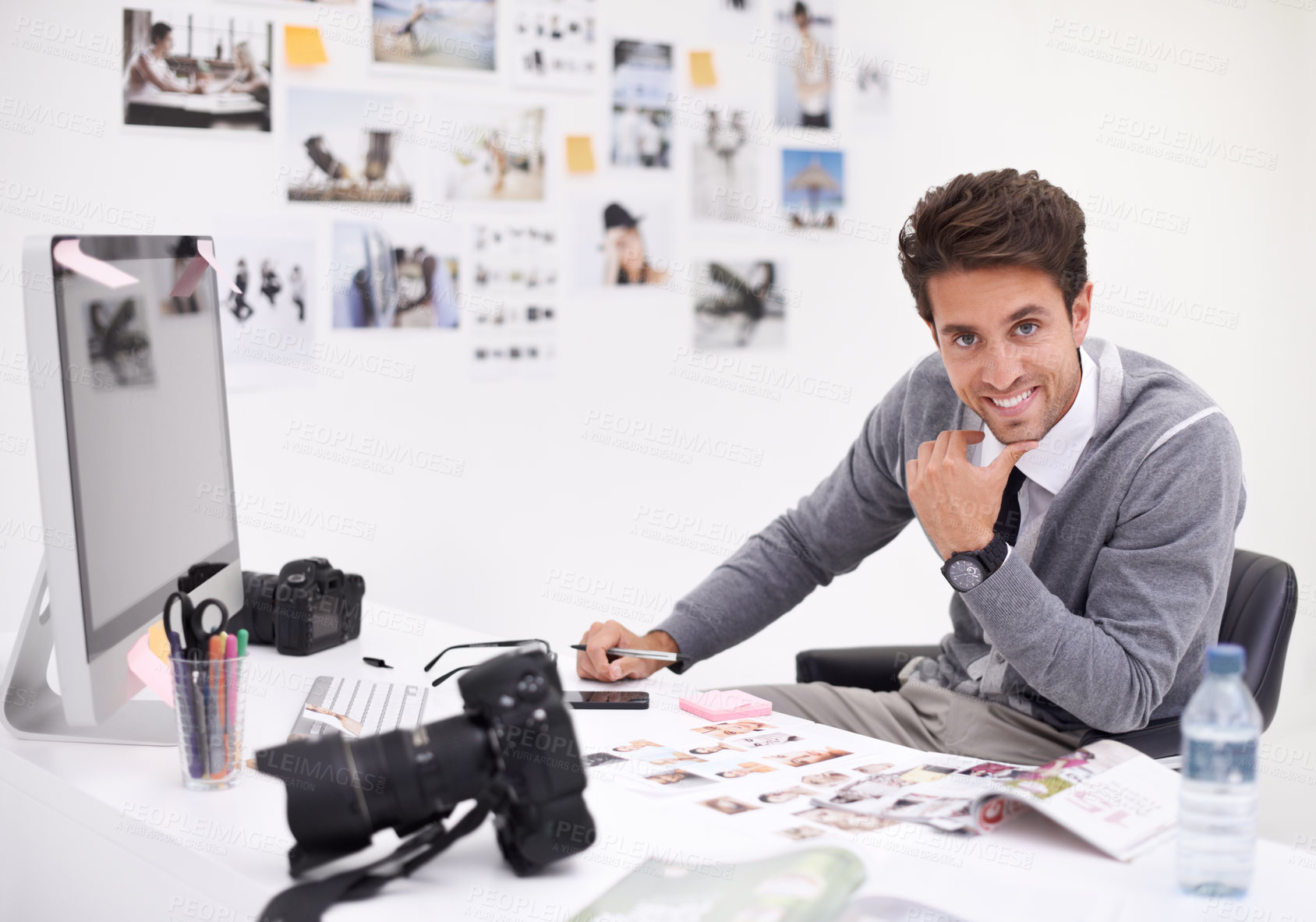 Buy stock photo A photographer looking at his images in his office