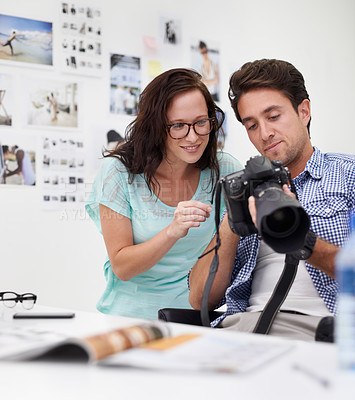Buy stock photo Camera, office and photographer team looking at photoshoot in a studio or workshop for production. Creative, photography and young artists with dslr equipment for picture inspection in workplace.