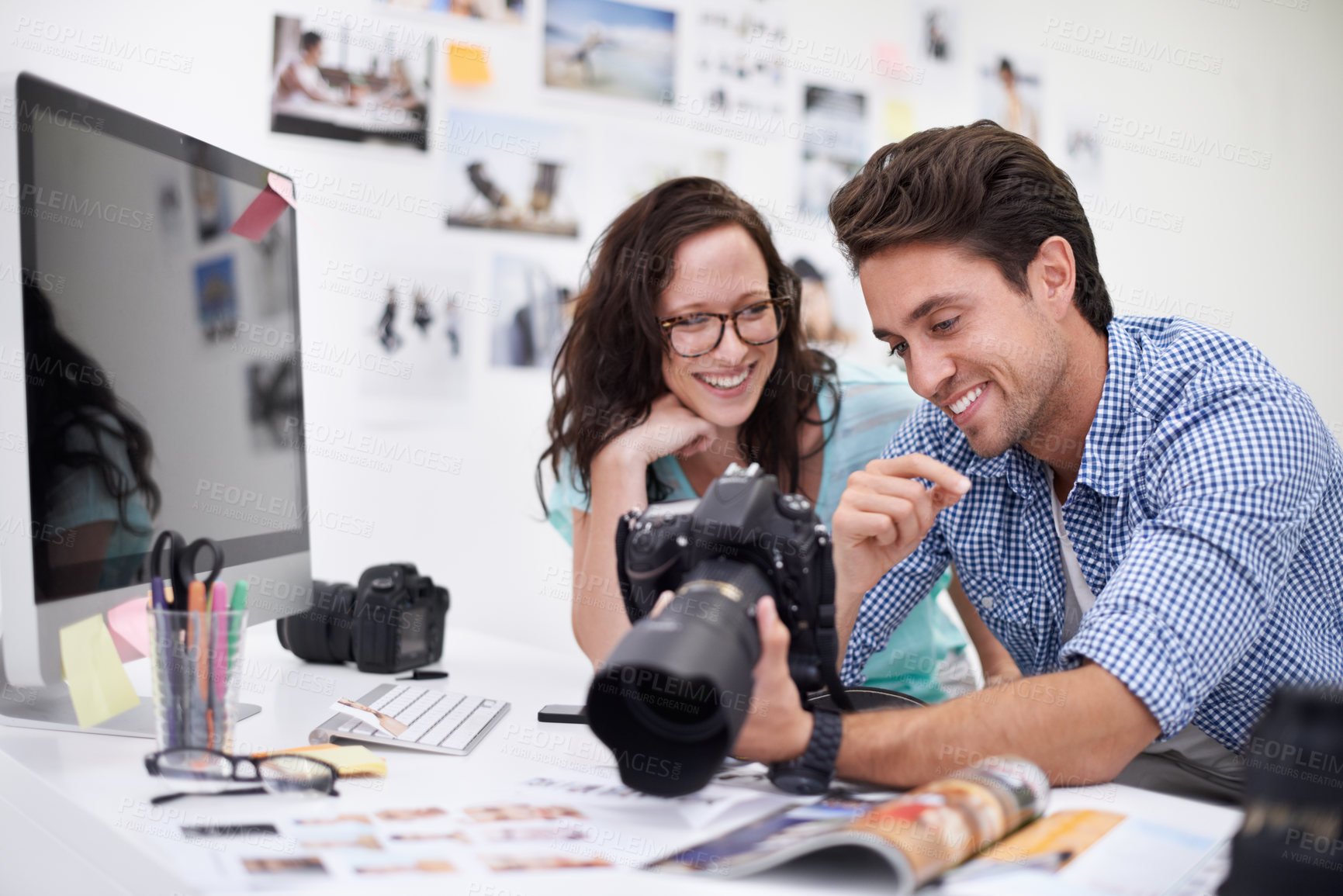 Buy stock photo Happy photographers, smile and camera at office for photo, memory or teamwork at the studio. Man and woman in team photography smiling for digital advertising, marketing or photos at the workplace