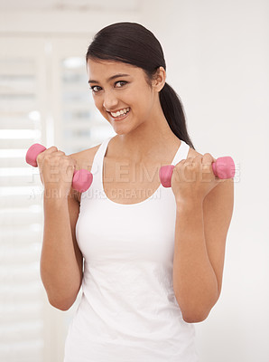Buy stock photo Woman, portrait and dumbbells for workout at gym, fitness and strong biceps or muscle growth. Happy female person, smiling and weights for exercise and training, equipment and tools for athlete