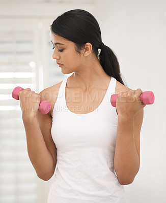 Buy stock photo Woman, dumbbell and home fitness with workout, wellness and exercise in living room with weights. Health, Indian female person and house gym with training and healthy routine for athlete in a house