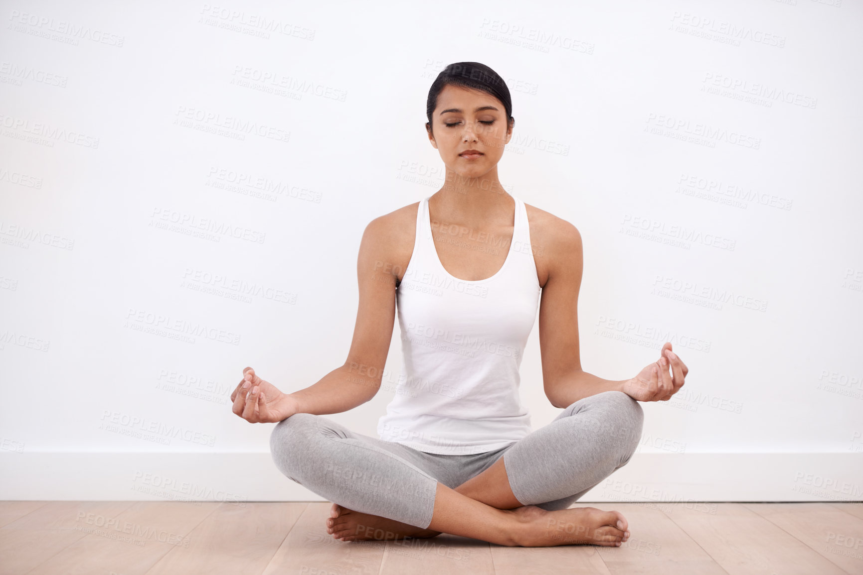 Buy stock photo Woman, meditation and spiritual in a home with lotus pose and sitting for balance and mindfulness. Morning, wellness and zen in house on the floor to relax for calm breathing and inner peace 