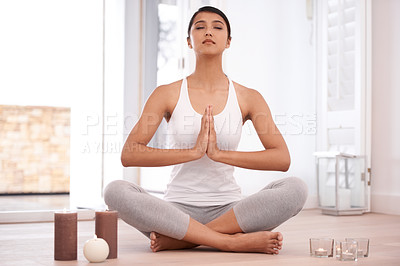 Buy stock photo Woman, pray and meditation for yoga and mindfulness at home, fitness and health with healing and candles. Peace, calm and zen with young yogi in apartment, self care and wellness with aura balance