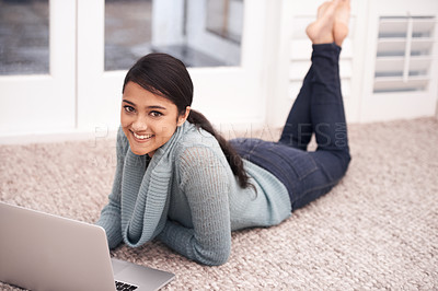 Buy stock photo Portrait of woman on floor with laptop, smile and relax with studying, college research and browse on web. University student girl on carpet with computer, elearning and online education in home.