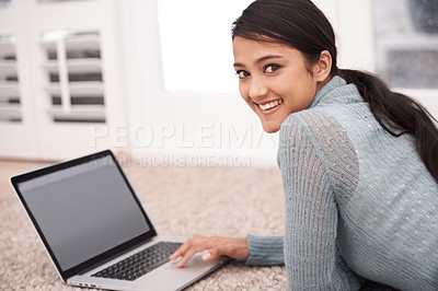 Buy stock photo Portrait of woman on carpet with laptop, smile and relax with studying, research and browse on web in living room. Happy student girl on floor with computer, elearning and online education in home.
