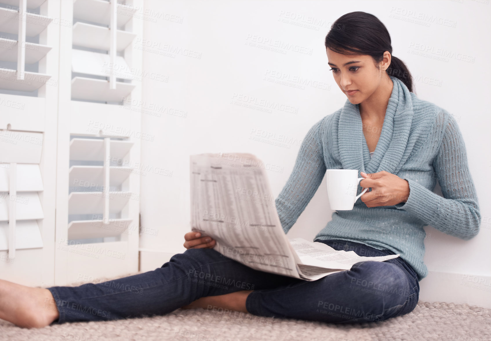 Buy stock photo Woman, reading and newspaper with coffee in a home at morning with story, article and news. Relax, press print and calm female person from India with paper publication and media in a house on floor