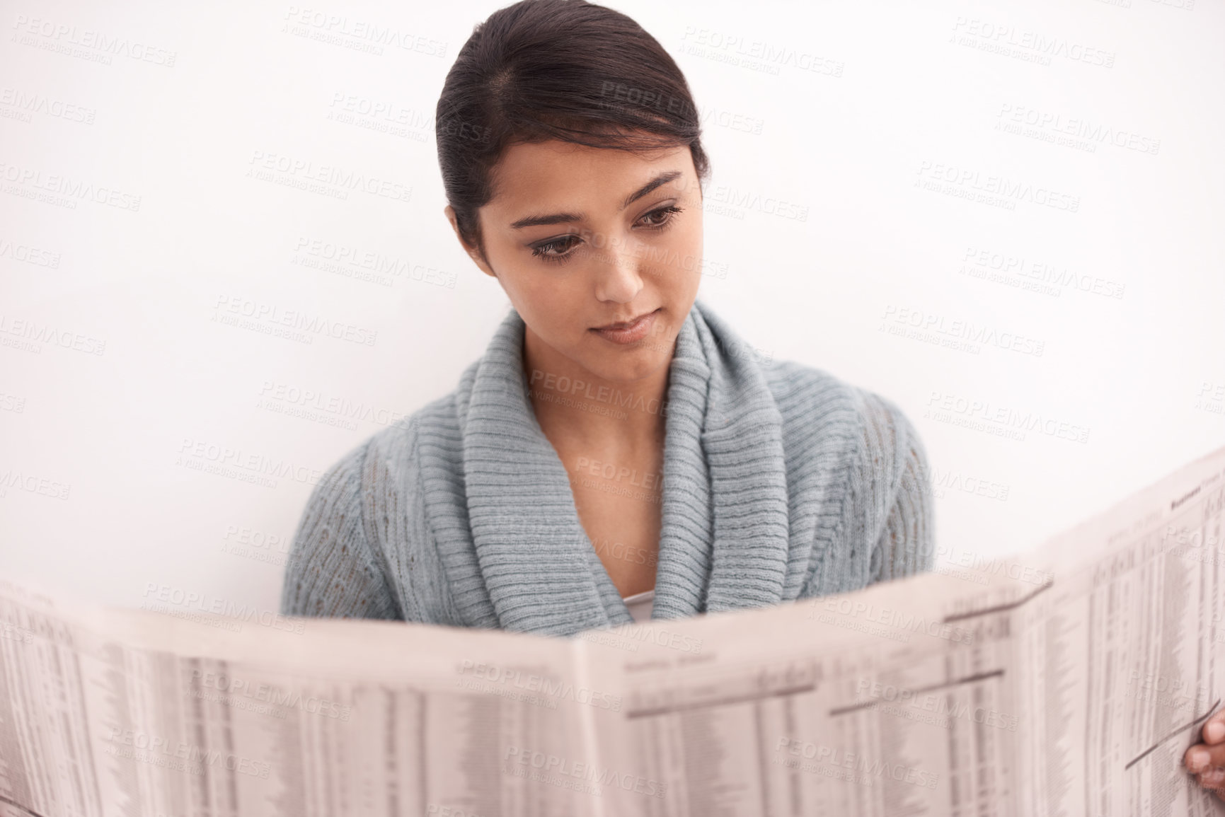 Buy stock photo Indian woman, reading and newspaper in a home in the morning with story, article and news. Relax, press print and calm female person with paper publication and media in a house with information
