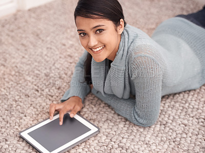 Buy stock photo Portrait of happy woman on floor with tablet, relax and smile with studying, research and social media in house. Student girl on carpet with digital app, elearning and checking blog online in home.