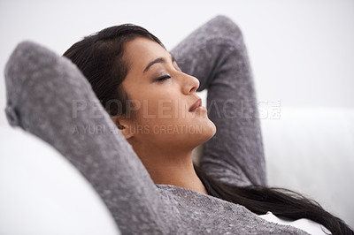 Buy stock photo A young woman taking a nap on her sofa
