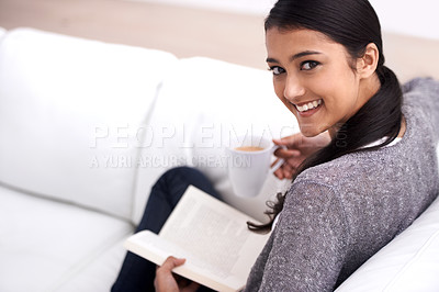 Buy stock photo Woman, book and coffee on sofa for reading, learning and education in literature, language or knowledge. Portrait of Mexican student, relax with tea and living room with novel, fiction or happy story