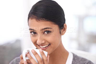 Buy stock photo Coffee, happy and portrait of Indian woman in home for relaxing, comfortable and calm. Apartment, morning and face of person smile with mug drinking hot beverage, tea and caffeine in living room
