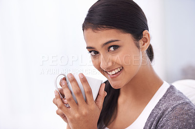 Buy stock photo Coffee, relax and portrait of Indian woman on sofa for wellness, comfortable and calm in home. Apartment, morning and happy person with mug drinking hot beverage, tea and caffeine in living room