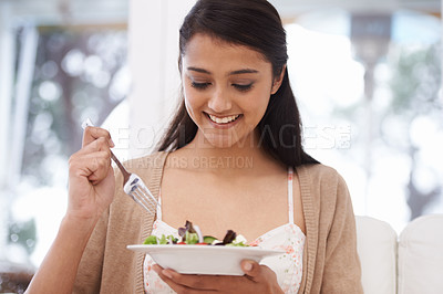Buy stock photo Happy woman, bowl and eating salad for diet, healthy snack or natural nutrition on sofa in living room at home. Female person, vegan or nutritionist smile with mix vegetables for weight loss at house
