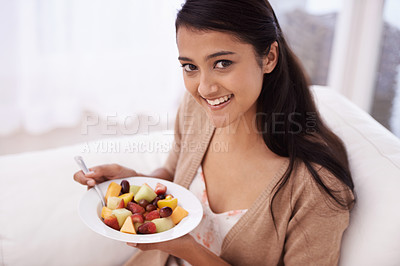 Buy stock photo Happy woman, portrait and bowl of fruit in diet, nutrition or healthy snack on sofa at home. Face of young female person, nutritionist or vegan smile and eating breakfast for vitamin c, salad or meal