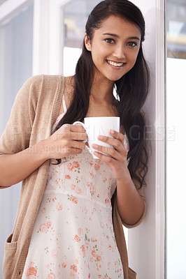 Buy stock photo Coffee, happy and portrait of woman in home for relaxing, comfortable and calm in apartment. Happiness, morning and person with mug drinking hot beverage, tea and caffeine in living room for wellness