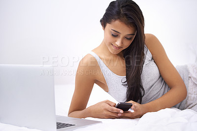 Buy stock photo Woman, student and communication on phone or texting, browsing and social media on mobile app at home. Happy female person, website and internet connection for studying in bedroom, smile and tech
