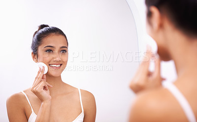Buy stock photo Happy woman, cotton pad and face in mirror for makeup, skincare or cosmetics in bathroom at home. Attractive female person or model smile for grooming, facial treatment or removal in reflection