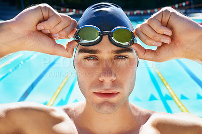 Buy stock photo Man, pool and face portrait with goggles, cap or sport with swimming exercise for wellness, health or fitness. Swimmer, athlete or person by water for race, contest and closeup at summer games