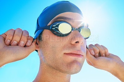 Buy stock photo Swimming cap, goggles and sports man ready for exercise, outdoor workout or training for summer contest. Swimwear, blue sky or face of swimmer start waterpolo competition, cardio or fitness challenge