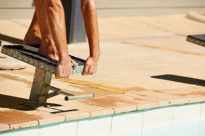 Buy stock photo A young man diving off a starting block